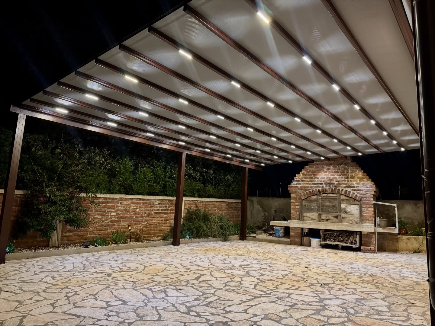 Interior LED lighting detail of pergola awning at night — integrated light strips on aluminum profiles, Turkey