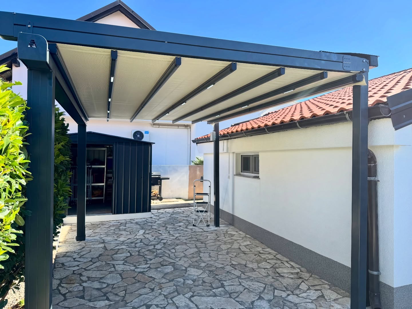 Front view of pergola awning on residential garden — anthracite aluminum posts with LED, Turkey