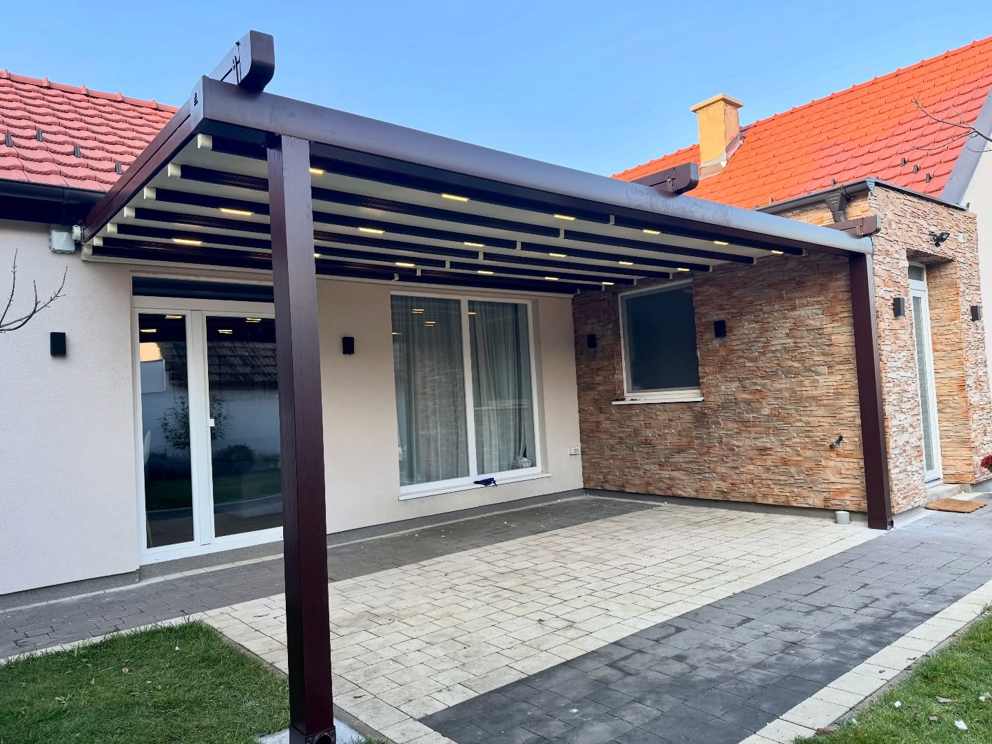 Pergola awning with integrated LED lighting — RAL 8017 brown aluminum frame, residential installation Turkey