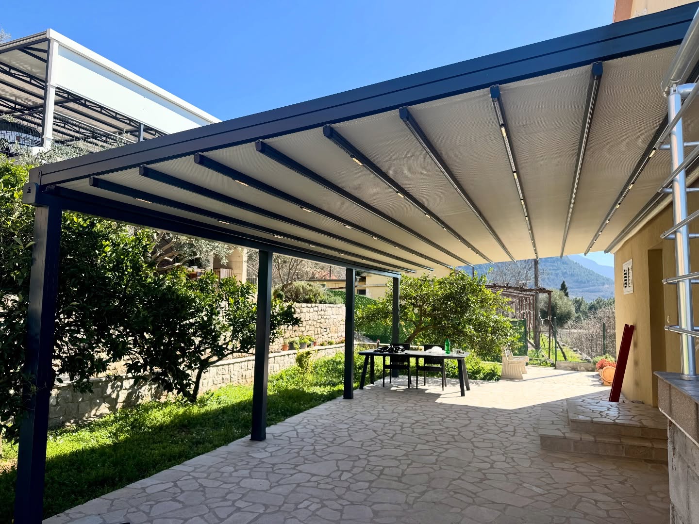 Pergola awning covering villa garden terrace — anthracite aluminum, Turkey export